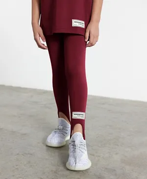 The Giving Movement Sustainable Recycled Stirrup Leggings - Maroon