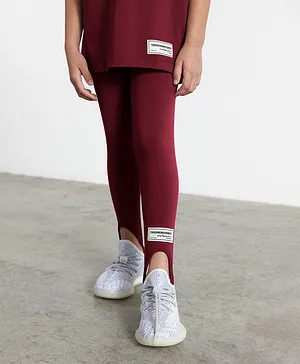 The Giving Movement Sustainable Recycled Stirrup Leggings - Maroon